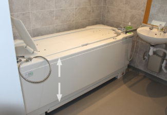 Gemini 2000 bath raises and lowers using a powered hand control
