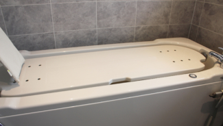 Lowered Gemini 2000 powered height adjustable bath and seating platform