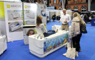 Demonstrating a powered height adjustable bath at the OT Show
