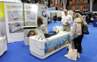 Demonstrating a powered height adjustable bath at the OT Show