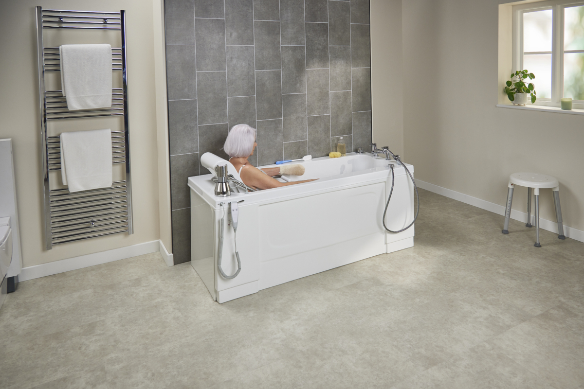 bathing in a wetroom in a bath with an adjustable seat