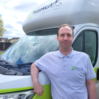 man stood next to Abacus demonstration vehicle